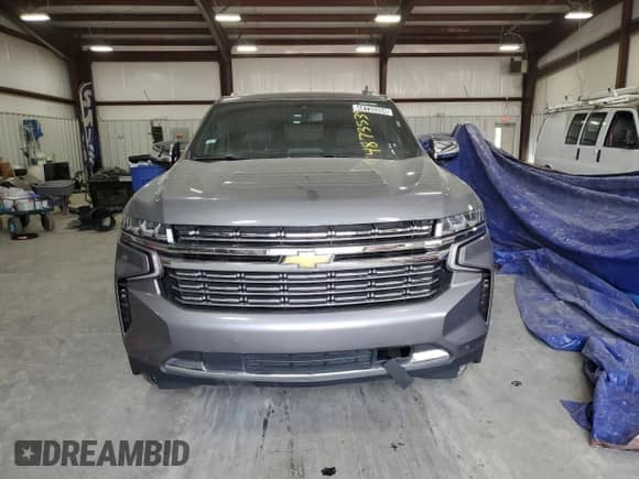 2021 Chevrolet Suburban Premier z VIN 1GNSCFKD7MR281130, wystawiony jako Copart lot #48735394 z przebiegiem 81 245 mil mil oraz Czysty tytuł • Clean title. Historia ofert i sprzedaży dostępna na DreamBid. Obrazek 5.