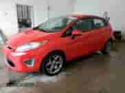 2012 Ford Fiesta SES with VIN 3FADP4FJ2CM106588, listed as a Copart auction lot 68701555 with 176,916 mi miles and Salvage title. Bid and sale history available at DreamBid. Image 1.