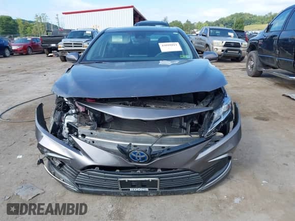 2021 Toyota Camry Hybrid LE with VIN 4T1H31AK0MU553127, listed as a IAAI auction lot 43099811 with 27,442 mi miles and . Bid and sale history available at DreamBid. Image 12.