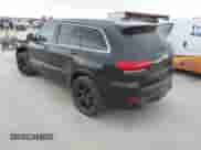 2015 Jeep Grand Cherokee SRT with VIN 1C4RJFDJXFC861770, listed as a IAAI auction lot 41698296 with 74,135 mi miles and . Bid and sale history available at DreamBid. Image 3.