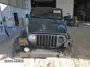 2002 Jeep Wrangler Sport z VIN 1J4FA49S22P715529, wystawiony jako Copart lot #89871905 z przebiegiem 133 220 mil mil oraz Szkoda całkowita • Salvage title. Historia ofert i sprzedaży dostępna na DreamBid. Obrazek 5.