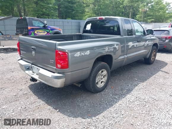 2005 Dodge Dakota SLT with VIN 1D7HW42N25S155393, listed as a IAAI auction lot 42727690 with 230,042 mi miles and . Bid and sale history available at DreamBid. Image 4.