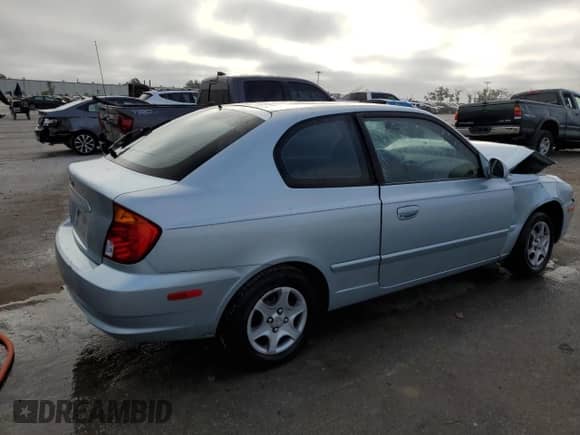 2004 Hyundai Accent GL с VIN KMHCG35CX4U293817, выставлен на аукционе Copart как лот 86087074 с пробегом Не указан миль и Списание • Salvage title. История ставок и продаж доступна на DreamBid. Изображение 3.