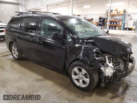 2012 Toyota Sienna LE AAS with VIN 5TDKK3DC1CS265097, listed as a Copart auction lot 86068265 with 142,841 mi miles and Salvage title. Bid and sale history available at DreamBid. Image 4.