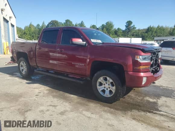 2017 Chevrolet Silverado 1500 LT with VIN 3GCUKREC7HG112885, listed as a Copart auction lot 85834235 with 156,632 mi miles and Salvage title. Bid and sale history available at DreamBid. Image 4.