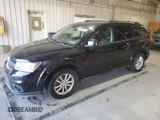 2013 Dodge Journey SXT with VIN 3C4PDCBGXDT716525, listed as a Copart auction lot 86057335 with 157,035 mi miles and Salvage title. Bid and sale history available at DreamBid. Image 1.