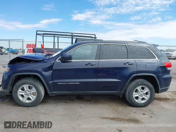 2015 Jeep Grand Cherokee Altitude z VIN 1C4RJFAG9FC636541, wystawiony jako IAAI lot #43100672 z przebiegiem 149 821 mil mil oraz . Historia ofert i sprzedaży dostępna na DreamBid. Obrazek 14.