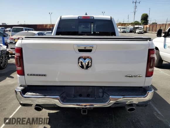 2020 Ram 1500 Laramie z VIN 1C6SRFJM6LN208434, wystawiony jako Copart lot #58059085 z przebiegiem 64 786 mil mil oraz Szkoda całkowita • Salvage title. Historia ofert i sprzedaży dostępna na DreamBid. Obrazek 6.