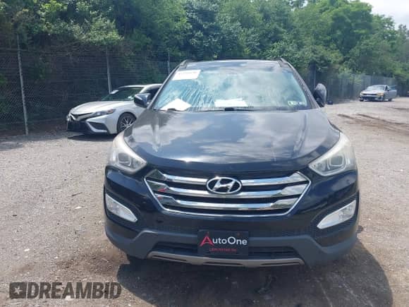 2014 Hyundai Santa Fe with VIN 5XYZWDLA0EG189400, listed as a IAAI auction lot 42391658 with 51,911 mi miles and . Bid and sale history available at DreamBid. Image 12.