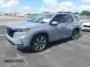 2024 Honda Pilot Elite with VIN 5FNYG1H84RB015114, listed as a IAAI auction lot 43082030 with 26,877 mi miles and . Bid and sale history available at DreamBid. Image 2.