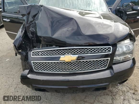 2012 Chevrolet Suburban LTZ z VIN 1GNSCKE00CR223070, wystawiony jako Copart lot #65436745 z przebiegiem Nie podano mil oraz Szkoda całkowita • Salvage title. Historia ofert i sprzedaży dostępna na DreamBid. Obrazek 12.