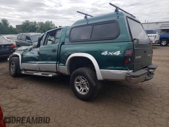2003 Dodge Dakota SLT z VIN 1D7HG48N73S239498, wystawiony jako Copart lot #57225245 z przebiegiem Nie podano mil oraz Szkoda całkowita • Salvage title. Historia ofert i sprzedaży dostępna na DreamBid. Obrazek 2.
