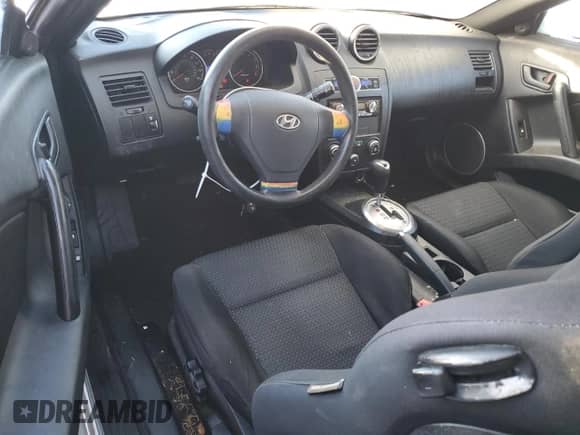2007 Hyundai Tiburon GS с VIN KMHHM66D97U255247, выставлен на аукционе Copart как лот 88322895 с пробегом 144 113 миль миль и Списание • Salvage title. История ставок и продаж доступна на DreamBid. Изображение 8.