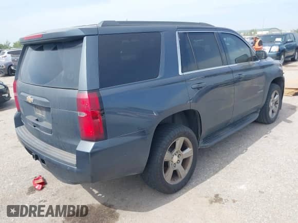 2019 Chevrolet Tahoe LS with VIN 1GNSCAKC3KR169156, listed as a IAAI auction lot 42867511 with 124,866 mi miles and . Bid and sale history available at DreamBid. Image 4.