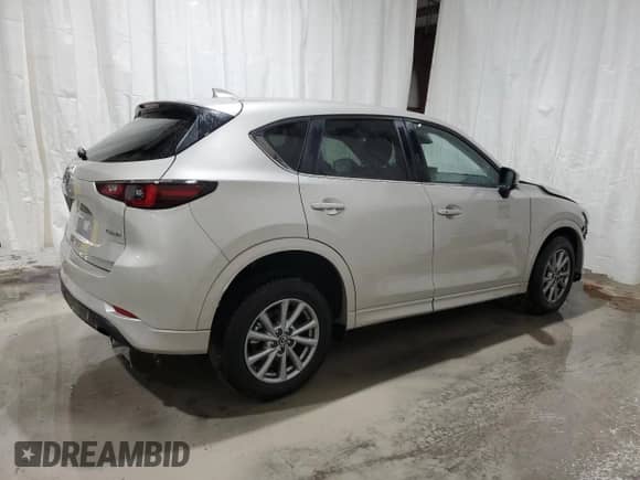 2025 Mazda CX-5 S Select z VIN JM3KFBBLXS0690411, wystawiony jako Copart lot #90328315 z przebiegiem Nie podano mil oraz Szkoda całkowita • Salvage title. Historia ofert i sprzedaży dostępna na DreamBid. Obrazek 3.