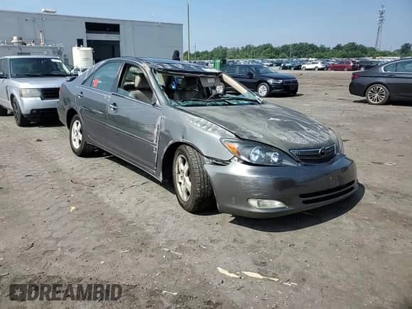 2002 Toyota Camry XLE with VIN JTDBF30K020036770, listed as a Copart auction lot 67023045 with Not provided miles and Salvage title. Bid and sale history available at DreamBid. Image 13.