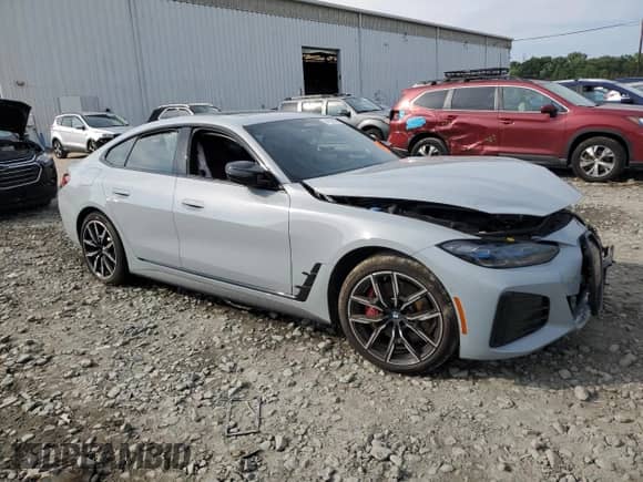 2023 BMW i4 M50 with VIN WBY33AW03PFN79198, listed as a Copart auction lot 61933085 with Not provided miles and Salvage title. Bid and sale history available at DreamBid. Image 4.