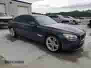 2014 BMW 7 Series 750i xDrive with VIN WBAYB6C53ED224559, listed as a Copart auction lot 58124485 with 114,753 mi miles and Salvage title. Bid and sale history available at DreamBid. Image 4.