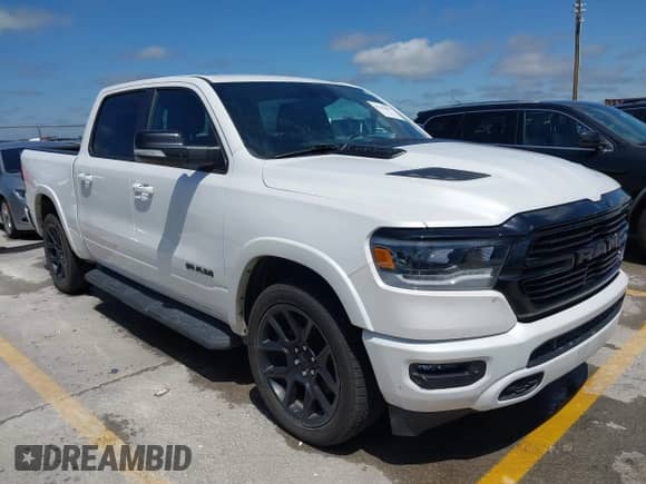 2021 Ram 1500 Laramie with VIN 1C6RREJTXMN704600, listed as a IAAI auction lot 42345097 with 80,180 mi miles and . Bid and sale history available at DreamBid. Image 1.