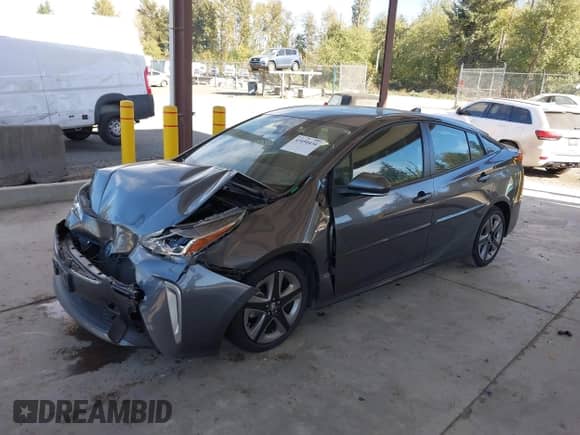 2022 Toyota Prius L Eco with VIN JTDKAMFUXN3155488, listed as a IAAI auction lot 43450434 with 39,407 mi miles and . Bid and sale history available at DreamBid. Image 16.
