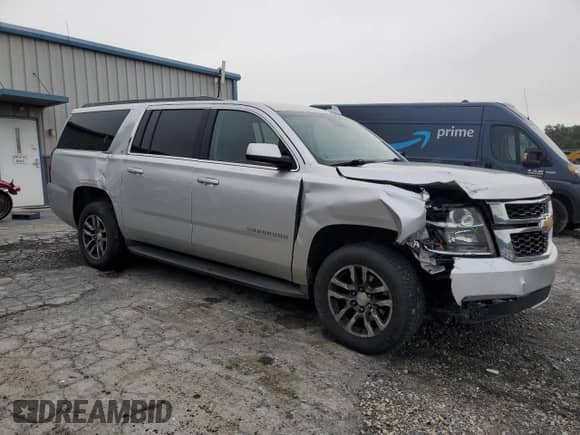 2018 Chevrolet Suburban LT with VIN 1GNSKHKCXJR255090, listed as a Copart auction lot 68005155 with 188,930 mi miles and Salvage title. Bid and sale history available at DreamBid. Image 4.