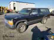 1996 Dodge Dakota z VIN 1B7GG26Y4TS602492, wystawiony jako Copart lot #74402554 z przebiegiem 252 298 mil mil oraz Czysty tytuł • Clean title. Historia ofert i sprzedaży dostępna na DreamBid. Obrazek 1.