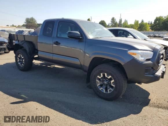 2023 Toyota Tacoma SR z VIN 3TYRX5GN9PT087510, wystawiony jako Copart lot #71041585 z przebiegiem 13 094 mil mil oraz Szkoda całkowita • Salvage title. Historia ofert i sprzedaży dostępna na DreamBid. Obrazek 4.
