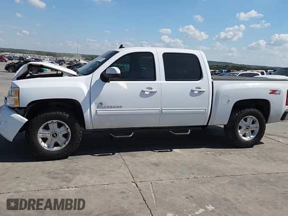 2013 Chevrolet Silverado 1500 LTZ z VIN 3GCPKTE79DG245753, wystawiony jako Copart lot #85829525 z przebiegiem 165 504 mil mil oraz Szkoda całkowita • Salvage title. Historia ofert i sprzedaży dostępna na DreamBid. Obrazek 13.
