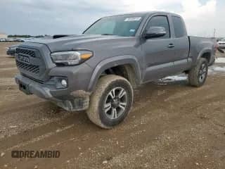 2016 Toyota Tacoma SR5 с VIN 5TFSZ5AN0GX019364, выставлен на аукционе Copart как лот 70156415 с пробегом 99 435 миль миль и Списание • Salvage title. История ставок и продаж доступна на DreamBid. Изображение 1.