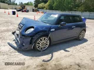 2015 MINI Hardtop S with VIN WMWXP7C54FT740648, listed as a Copart auction lot 55412595 with 51,810 mi miles and Salvage title. Bid and sale history available at DreamBid. Image 1.
