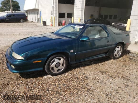 1993 Dodge Daytona with VIN 1B3XW64AXPN590208, listed as a Copart auction lot 71482934 with 131,876 mi miles and Salvage title. Bid and sale history available at DreamBid. Image 1.