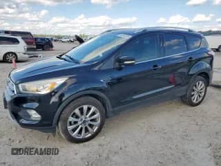 2017 Ford Escape Titanium с VIN 1FMCU0JDXHUE46871, выставлен на аукционе Copart как лот 84042315 с пробегом 89 103 миль миль и Списание • Salvage title. История ставок и продаж доступна на DreamBid. Изображение 1.