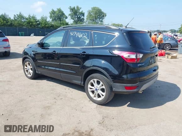 2018 Ford Escape SE with VIN 1FMCU9GD8JUC47268, listed as a IAAI auction lot 42941602 with 87,617 mi miles and . Bid and sale history available at DreamBid. Image 3.