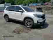 2023 Honda Passport EX-L with VIN 5FNYF8H55PB010292, listed as a Copart auction lot 62869945 with 44,324 mi miles and Salvage title. Bid and sale history available at DreamBid. Image 14.