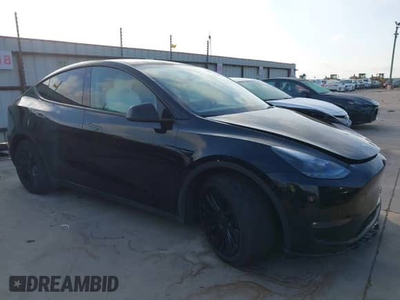 2023 Tesla Model Y Long Range z VIN 7SAYGAEE7PF767951, wystawiony jako IAAI lot #43128878 z przebiegiem 36 431 mil mil oraz . Historia ofert i sprzedaży dostępna na DreamBid. Obrazek 1.