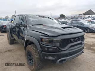 2023 Ram 1500 TRX z VIN 1C6SRFU97PN572634, wystawiony jako IAAI lot #42034438 z przebiegiem 5 032 mil mil oraz . Historia ofert i sprzedaży dostępna na DreamBid. Obrazek 1.