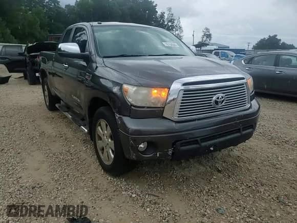 2012 Toyota Tundra Limited z VIN 5TFSY5F10CX132864, wystawiony jako Copart lot #70156505 z przebiegiem 186 395 mil mil oraz Szkoda całkowita • Salvage title. Historia ofert i sprzedaży dostępna na DreamBid. Obrazek 13.