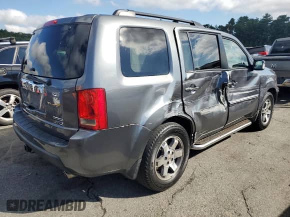 2010 Honda Pilot Touring with VIN 5FNYF4H9XAB005981, listed as a Copart auction lot 71617615 with 183,441 mi miles and Salvage title. Bid and sale history available at DreamBid. Image 3.