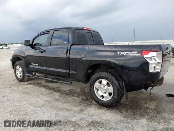 2013 Toyota Tundra z VIN 5TFUM5F1XDX046077, wystawiony jako Copart lot #65893365 z przebiegiem 240 153 mil mil oraz Szkoda całkowita • Salvage title. Historia ofert i sprzedaży dostępna na DreamBid. Obrazek 2.