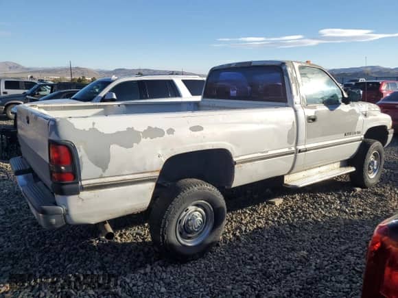 1994 Dodge RAM with VIN 1B6KF26W2RS724969, listed as a Copart auction lot 77032574 with 168,177 mi miles and Salvage title. Bid and sale history available at DreamBid. Image 3.