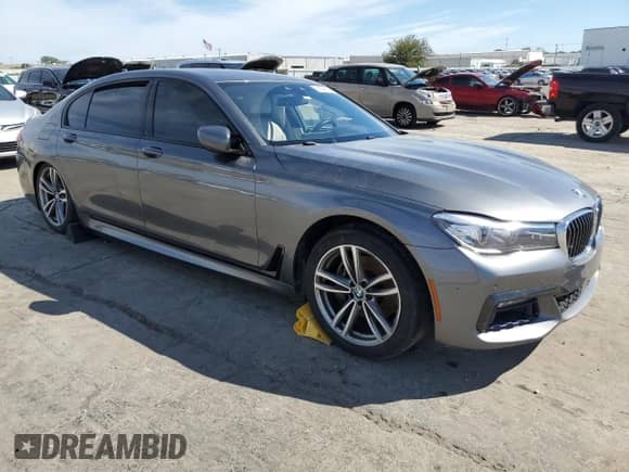 2018 BMW 7 Series 740e xDrive with VIN WBA7J2C54JG938233, listed as a Copart auction lot 72694354 with 83,122 mi miles and Salvage title. Bid and sale history available at DreamBid. Image 4.