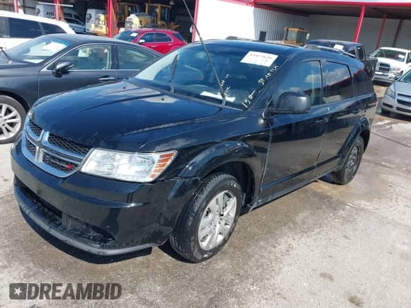 2017 Dodge Journey SE with VIN 3C4PDCAB9HT605136, listed as a IAAI auction lot 43423636 with 163,779 mi miles and . Bid and sale history available at DreamBid. Image 2.