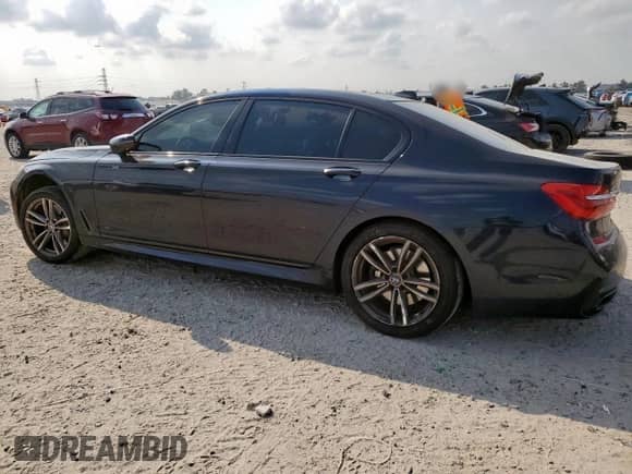 2016 BMW 7 Series 750i xDrive с VIN WBA7F2C57GG418330, выставлен на аукционе Copart как лот 80852555 с пробегом 129 555 миль миль и Списание • Salvage title. История ставок и продаж доступна на DreamBid. Изображение 2.
