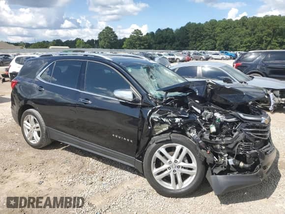 2019 Chevrolet Equinox Premier with VIN 3GNAXNEV9KL209297, listed as a Copart auction lot 64791585 with 105,810 mi miles and Salvage title. Bid and sale history available at DreamBid. Image 4.