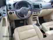 2014 Volkswagen Tiguan SEL with VIN WVGAV3AX7EW101796, listed as a Copart auction lot 60904345 with 97,652 mi miles and Salvage title. Bid and sale history available at DreamBid. Image 8.