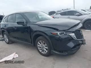 2023 Mazda CX-5 S Carbon Edition z VIN JM3KFBCM8P0202054, wystawiony jako IAAI lot #42392586 z przebiegiem 50 944 mil mil oraz . Historia ofert i sprzedaży dostępna na DreamBid. Obrazek 1.