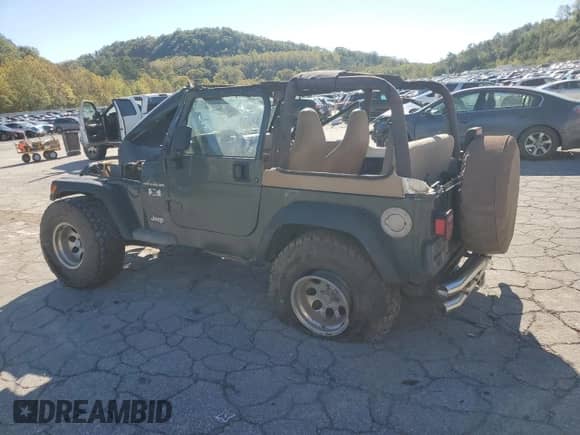 2002 Jeep Wrangler X z VIN 1J4FA39S12P776350, wystawiony jako Copart lot #82276415 z przebiegiem 196 023 mil mil oraz Szkoda całkowita • Salvage title. Historia ofert i sprzedaży dostępna na DreamBid. Obrazek 2.