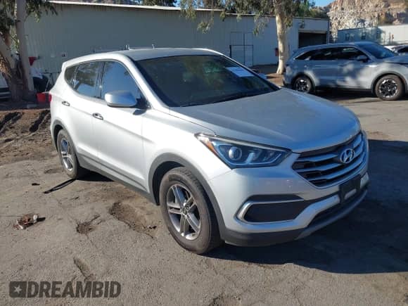 2018 Hyundai Santa Fe 2.4L with VIN 5XYZT3LB3JG565285, listed as a IAAI auction lot 43486666 with 124,869 mi miles and . Bid and sale history available at DreamBid. Image 1.