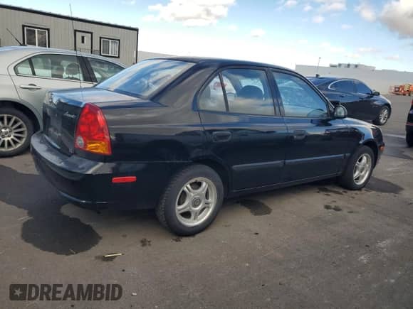 2003 Hyundai Accent GL с VIN KMHCG45C43U429167, выставлен на аукционе Copart как лот 79658124 с пробегом 80 926 миль миль и Чистый • Clean title. История ставок и продаж доступна на DreamBid. Изображение 3.
