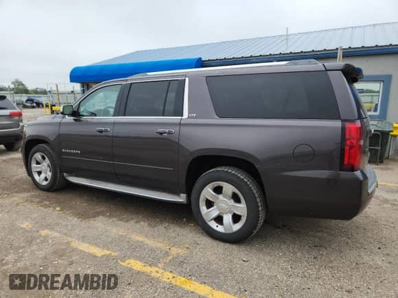 2015 Chevrolet Suburban LTZ z VIN 1GNSKKKC7FR254340, wystawiony jako Copart lot #82104195 z przebiegiem 152 947 mil mil oraz Szkoda całkowita • Salvage title. Historia ofert i sprzedaży dostępna na DreamBid. Obrazek 2.
